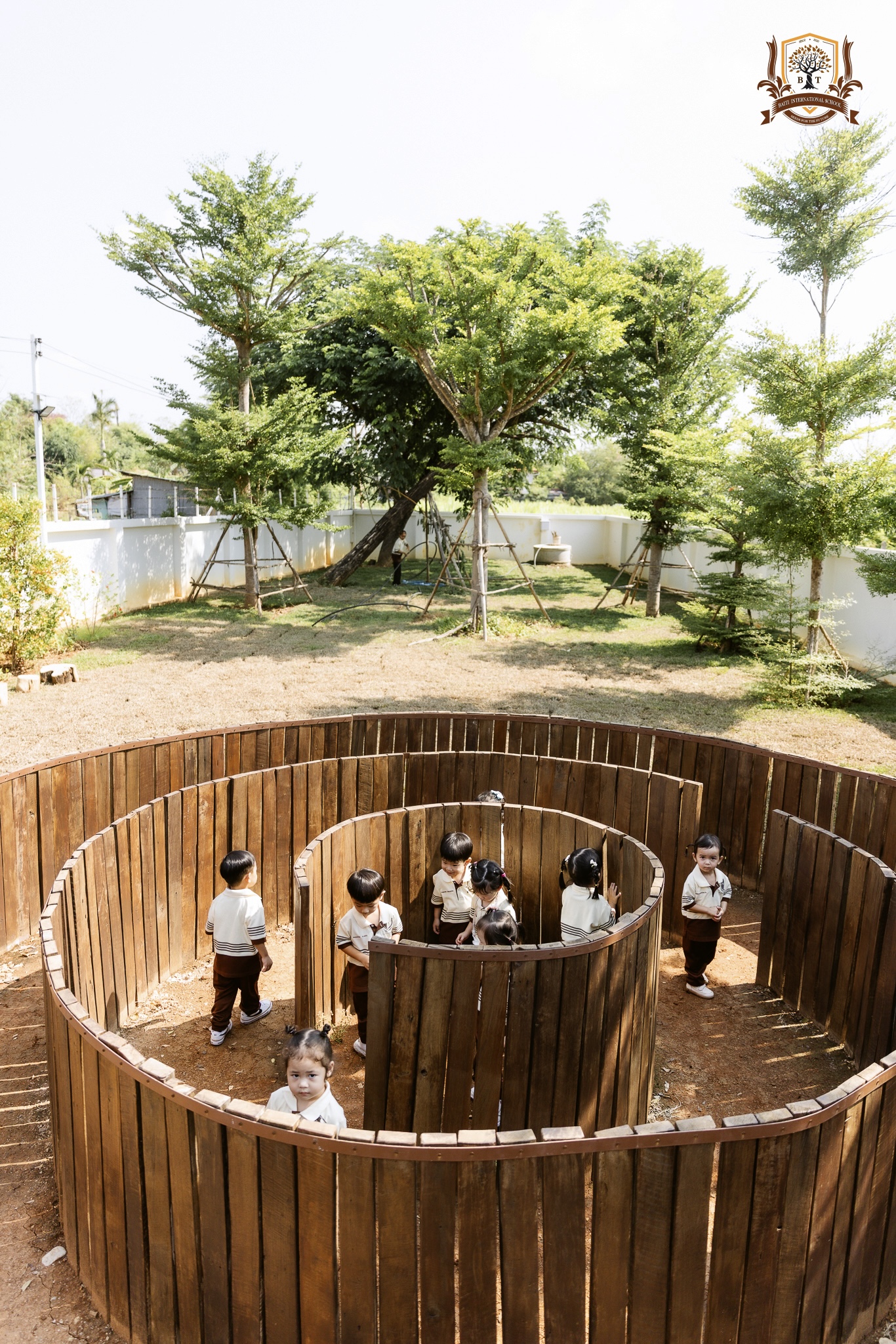 Young Baiti students learning outdoors